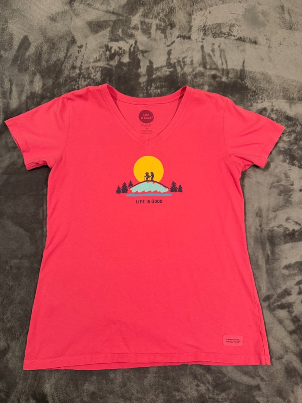Life Is Good Coral Pink Short Sleeve V‑Neck Tee with Sunset Graphic